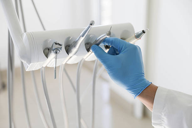 Professional Emergency Dentist technician working in Comstock Northwest, MI